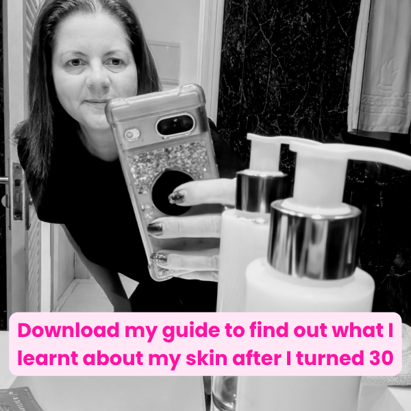 picture of a person holding a mobile phone with a bottle of body lotion
